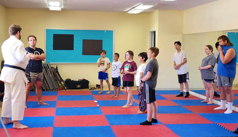 children learning martial arts